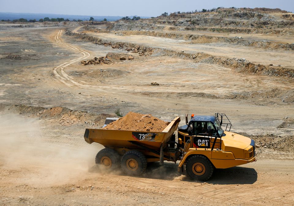 A truck is seen loaded with rocks for processing at an open pit at Dorowa mine in Hwedza, Zimbabwe, on October 22, 2019. File Photo / Reuters
