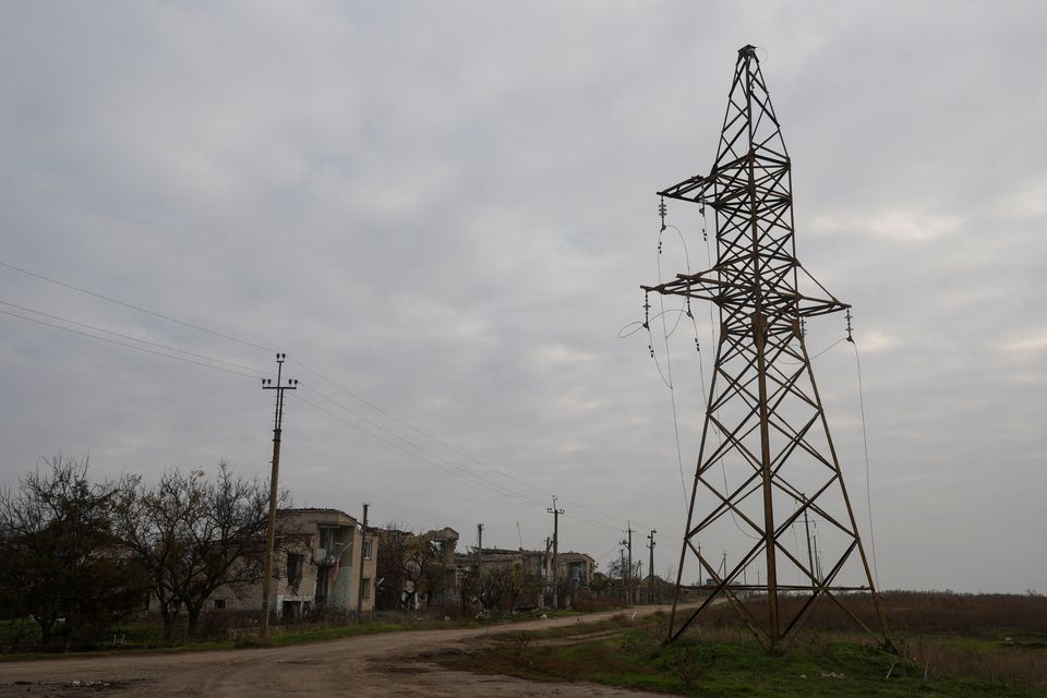 A views shows houses and a pylon with high-voltage wires damaged during Russian military attacks in the village of Osokorivka, in Kherson region, Ukraine, on November 9, 2022. REUTERS/Valentyn Ogirenko/File Photo