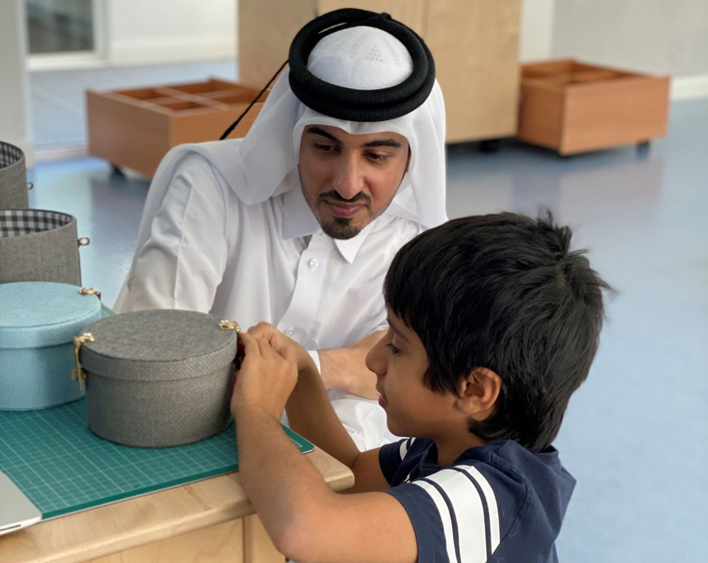   Dr. Nayef Alyafei with a student  at  Academyati  Academy. 