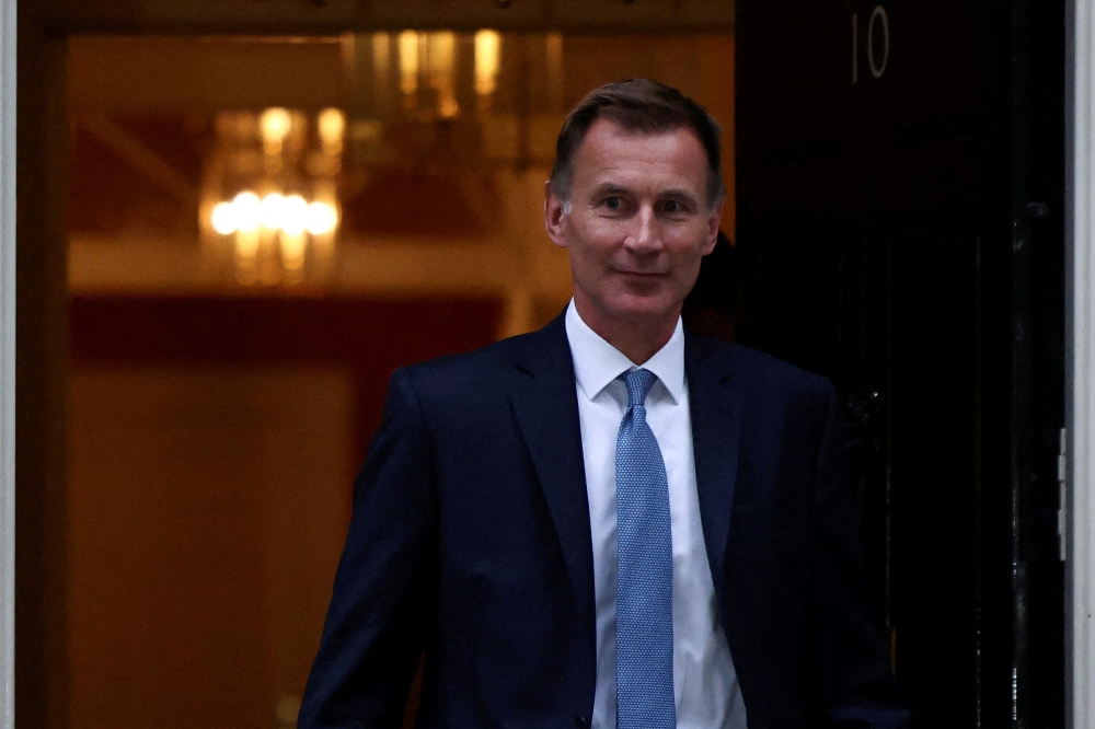 New Chancellor of the Exchequer Jeremy Hunt leaves 10 Downing Street in London, Britain, October 14, 2022. REUTERS/Henry Nicholls/File Photo