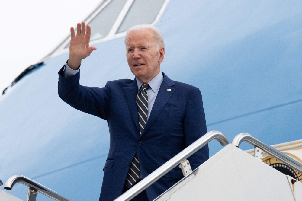 US President Joe Biden boards Air Force One prior to his departure from Cambodia's Phnom Penh International Airport on November 13, 2022, as he travels to Bali, Indonesia to attend the G20 Summit. (Photo by SAUL LOEB / AFP)