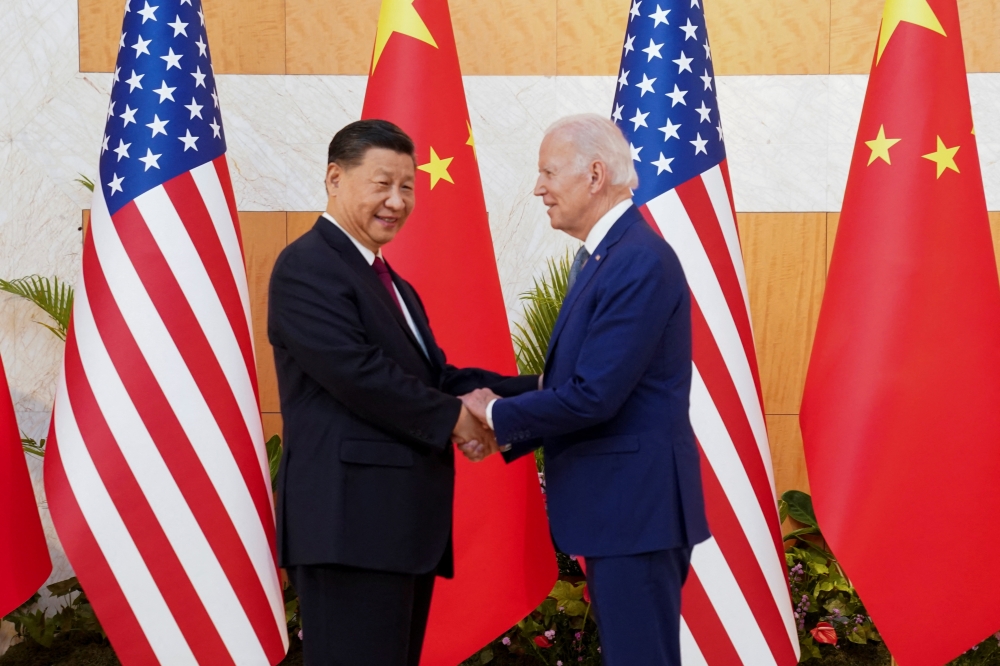 U.S. President Joe Biden shakes hands with Chinese President Xi Jinping on the sidelines of the G20 leaders' summit in Bali, Indonesia, November 14, 2022. Reuters/Kevin Lamarque