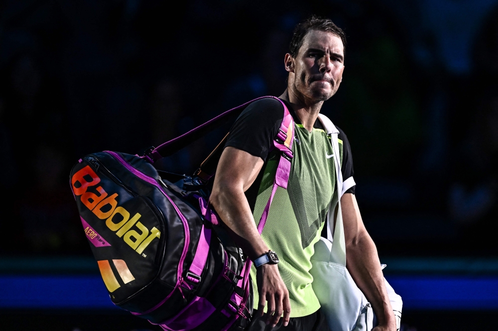 Spain's Rafael Nadal leaves after losing his round-robin match against Canada's Felix Auger-Aliassime on November 15, 2022 at the ATP Finals tennis tournament in Turin. (Photo by Marco BERTORELLO / AFP)