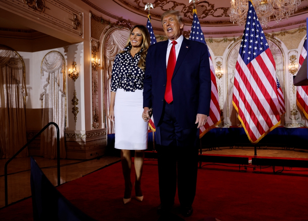 Former US first lady Melania Trump and former US President Donald Trump stand onstage together after Trump announced that he would once again run for US president in Palm Beach, Florida, U.S. November 15, 2022. Reuters/Jonathan Ernst