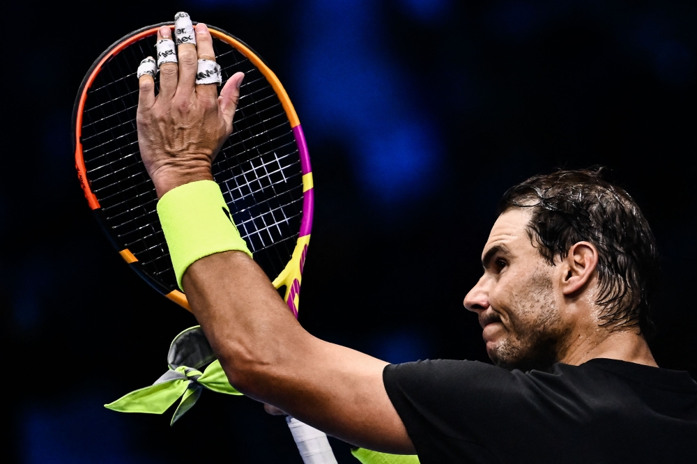 Spain's Rafael Nadal acknowledges the public after winning his round-robin match against Norway's Casper Ruud on November 17, 2022 at the ATP Finals tennis tournament in Turin. (Photo by Marco BERTORELLO / AFP)