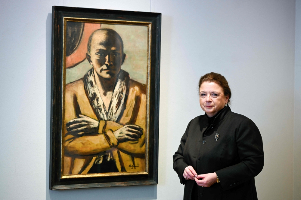 Micaela Kapitzky, director and partner of Berlin's Grisebach auction house, poses next to the painting 