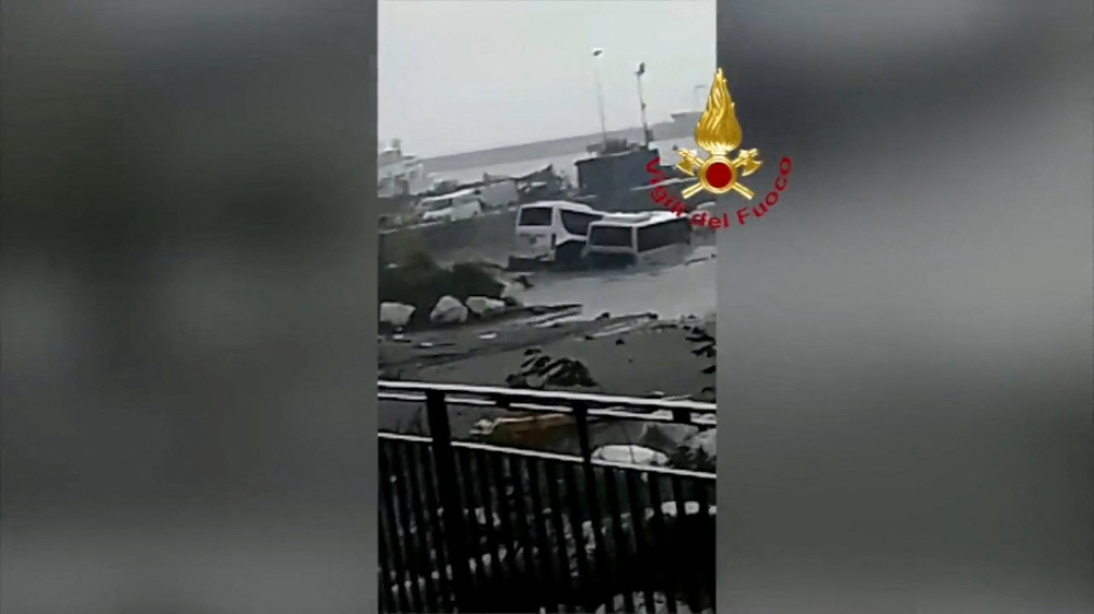 Damaged cars are seen in the sea, following a landslide on the Italian holiday island of Ischia, Italy November 26, 2022 in this still image taken from handout video. Vigili del Fuoco/Handout via Reuters