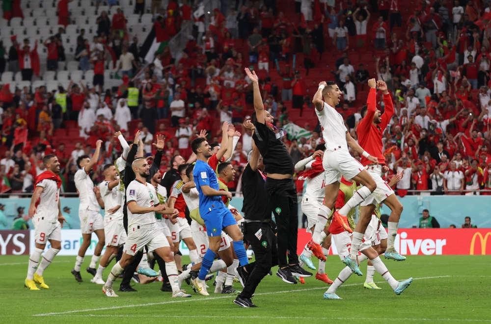 Morocco players celebrate after the their  FIFA World Cup Qatar 2022 Group F win against Belgium at the Al Thumama Stadium, Doha, Qatar, on November 27, 2022.  REUTERS/Matthew Childs