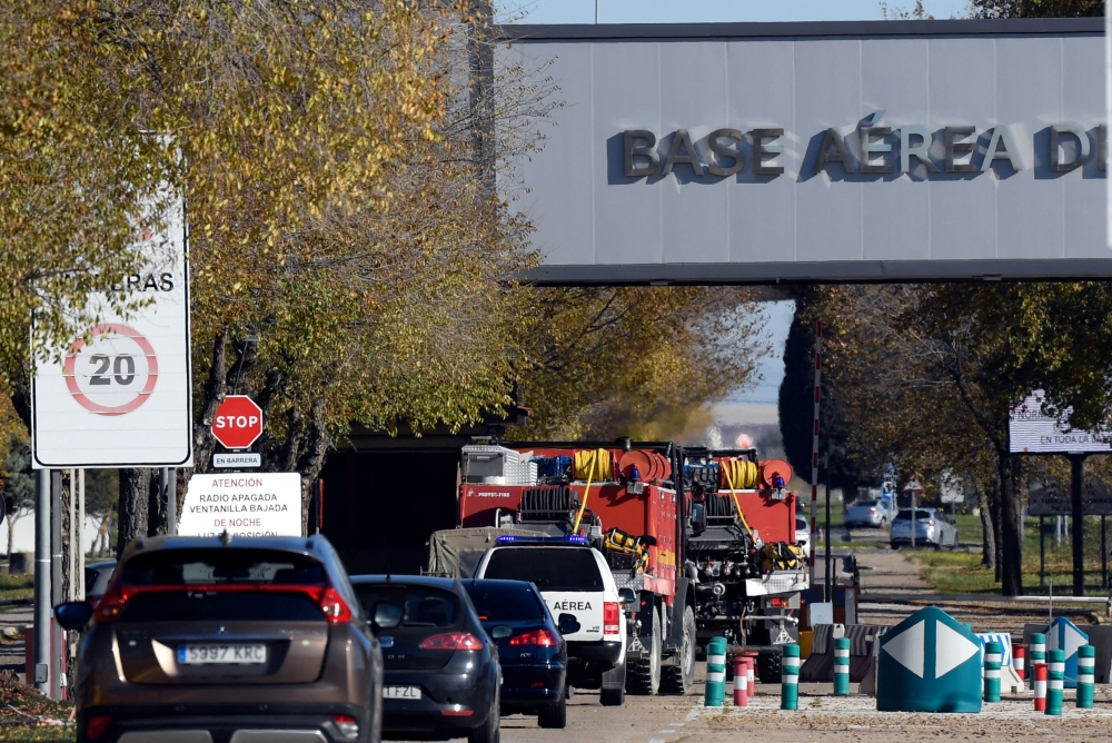 Military police stand guard at the main entrance of the Spanish air force base, in Torrejon de Ardoz near Madrid, on December 1, 2022, after Spain's security forces found a 