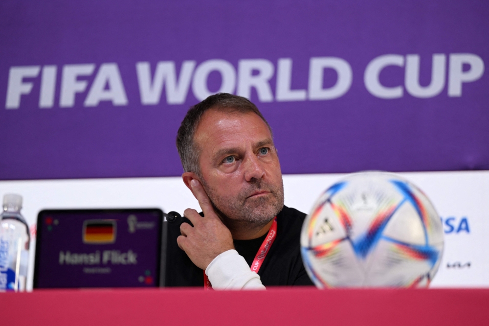 In this file photo taken on November 22, 2022 Germany's head coach Hans-Dieter Flick gives a press conference at the Qatar National Convention Center (QNCC) in Doha, on the eve of the Qatar 2022 World Cup football tournament Group E match between Germany and Japan. (Photo by Ina Fassbender / AFP)