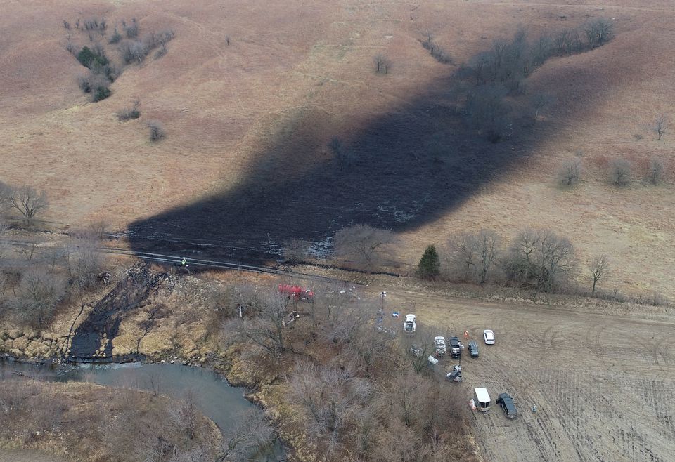 Emergency crews work to clean up the largest US crude oil spill in nearly a decade, following the leak at the pipeline operated by TC Energy in rural Washington County, Kansas, US, December 9, 2022. REUTERS/Drone Base
