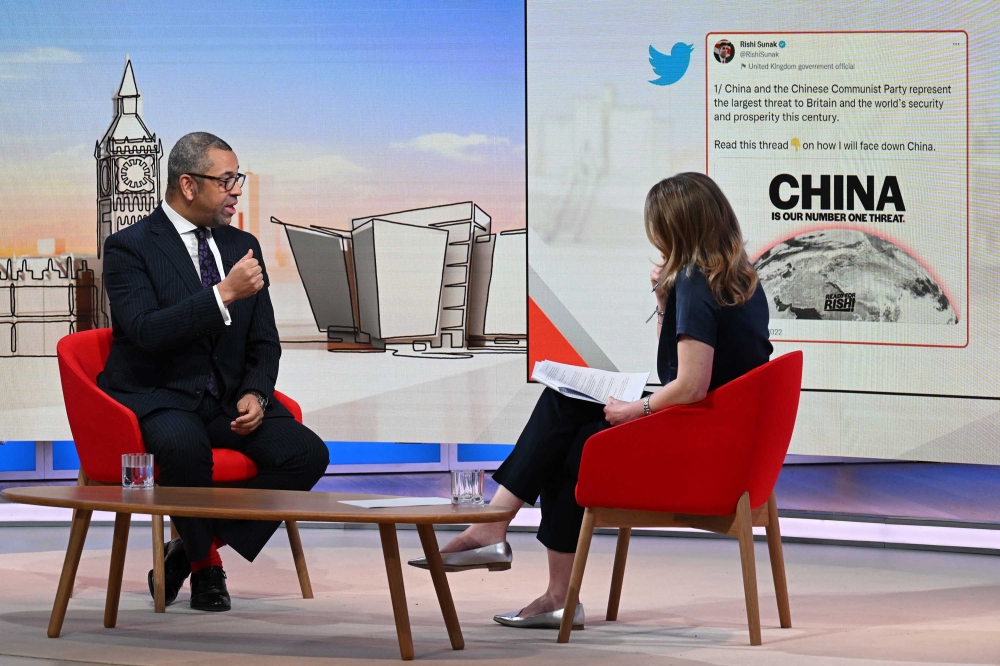 A handout picture released by the BBC, taken and received on December 11, 2022, shows Britain's Foreign Secretary James Cleverly during an appearance on the BBC's 'Sunday Morning' political television show with journalist Laura Kuenssberg at the BBC headquarters in London. (Photo by Jeff OVERS / BBC / AFP)