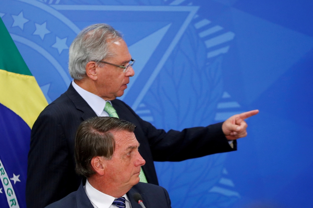 Brazil's President Jair Bolsonaro talks with Brazil's Economy Minister Paulo Guedes during a news conference at the Planalto Palace in Brasilia, Brazil, onJune 6, 2022. File Photo / Reuters