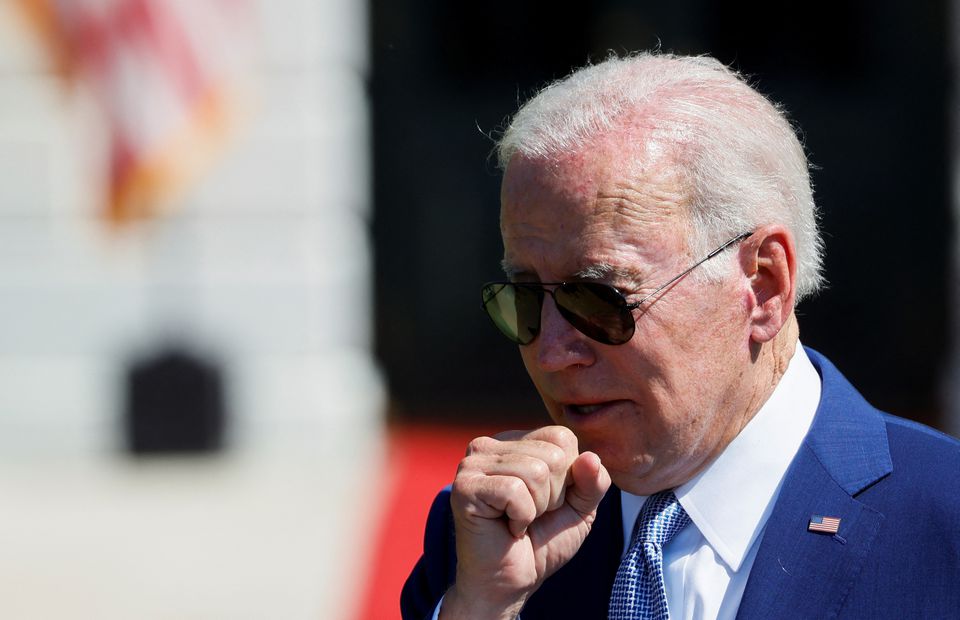 US President Joe Biden coughs during a signing event for the CHIPS and Science Act of 2022, on the South Lawn of the White House in Washington, US, August 9, 2022. File Photo / Reuters
