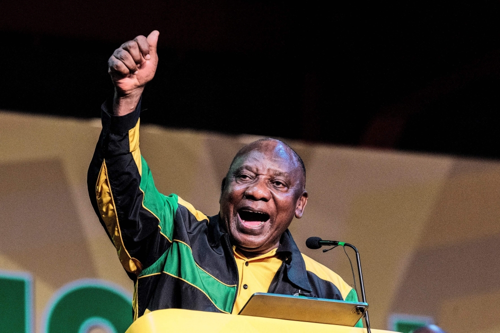 South African President Cyril Ramaphosa gives a speech to launch the 55th National Conference of the African National Congress (ANC) at the National Recreation Center (NASREC) in Johannesburg on December 16, 2022. (Photo by LUCA SOLA / AFP)