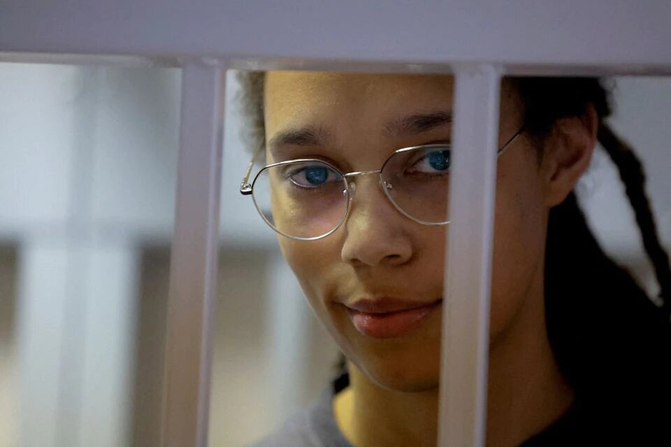 US basketball player Brittney Griner, who was detained at Moscow's Sheremetyevo airport and later charged with illegal possession of cannabis, stands inside a defendants' cage before a court hearing in Khimki outside Moscow on August 4, 2022.  File Photo / Reuters