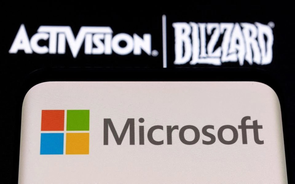 Microsoft logo is seen on a smartphone placed on displayed Activision Blizzard logo in this illustration taken January 18, 2022. REUTERS/Dado Ruvic/Illustration/File Photo
