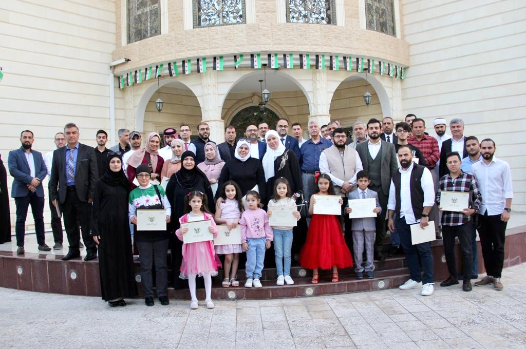 Chargé d’Affaires of Syrian Embassy in Qatar, Dr. Bilal Turkiyeh along with other officials and community members during the honouring ceremony.