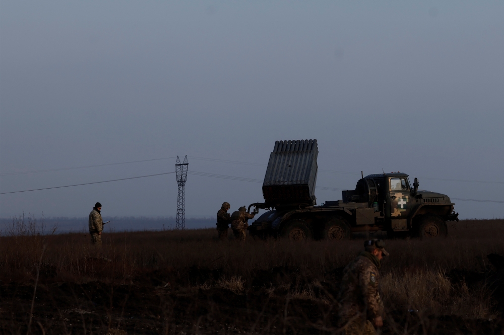 Ukrainian servicemen prepare BM-21 Grad multiple rocket launcher to fire, as Russia's attack on Ukraine continues, during intense shelling on Christmas Day at the frontline in Bakhmut, Ukraine, December 25, 2022. Reuters/Clodagh Kilcoyne