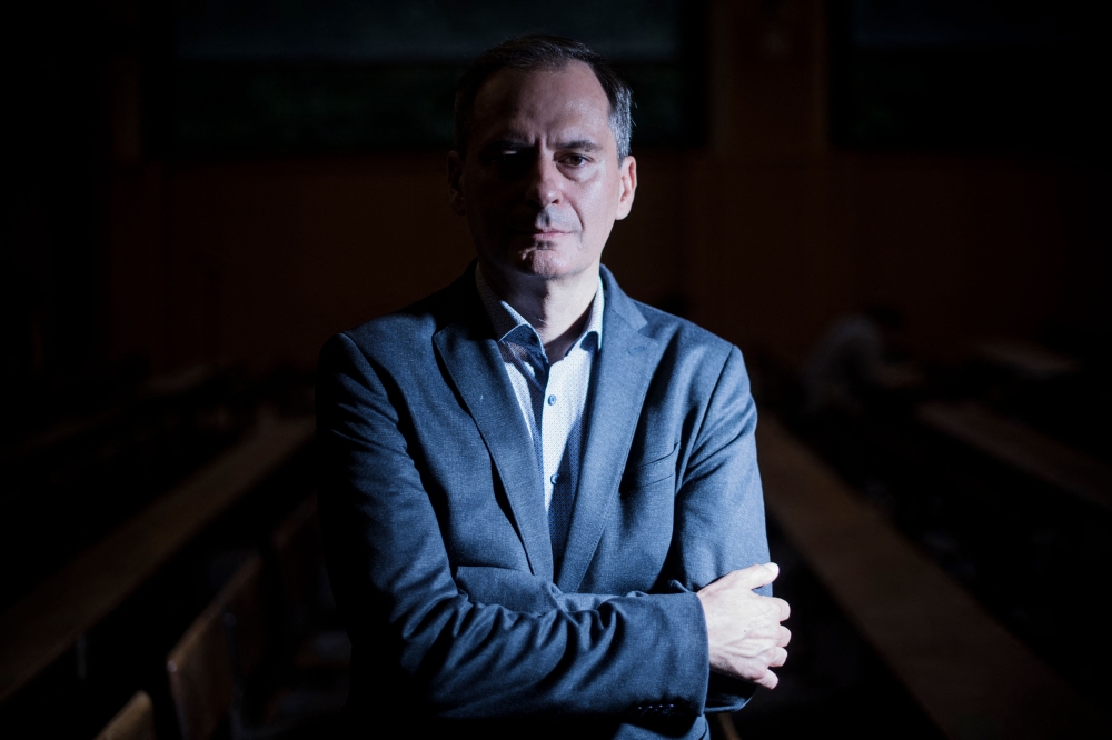 In this file photo taken on September 05, 2022 Bulgarian investigative journalist and lead Russia investigator with Bellingcat Christo Grozev poses for a photo session at the Institute of Political Studies (Sciences Po) in Paris.  (Photo by JULIEN DE ROSA / AFP)