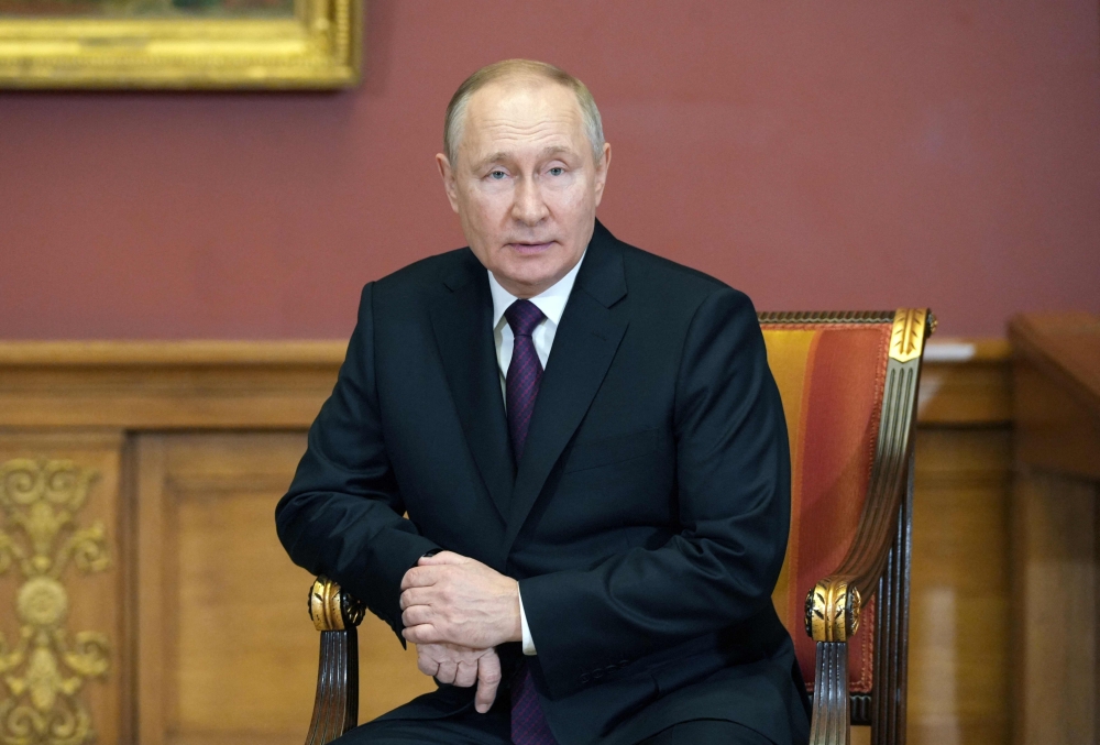 Russia's President Vladimir Putin looks on during a meeting with his Belarus counterpart on the sidelines of an informal summit of the heads of state of the Commonwealth of Independent States (CIS) at the State Russian Museum in Saint Petersburg on December 27, 2022. (Photo by ALEXEI DANICHEV / SPUTNIK / AFP) 
