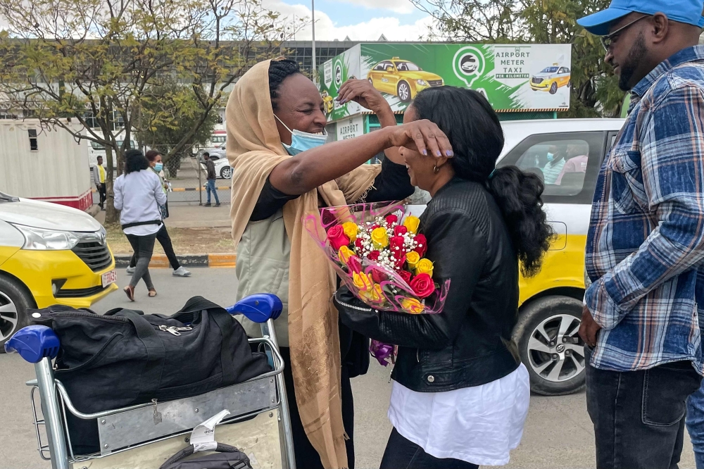 
Passengers arriving from Tigray are greeted by relatives at the Bole International Airport in Addis Ababa on December 28, 2022. (AFP)