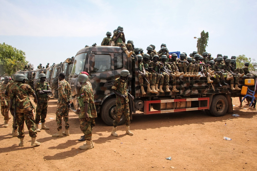Soldiers of the South Sudan People's Defence Forces (SSPDF) prepare to be deployed to the Democratic Republic of Congo (DRC) after their departure ceremony at the SSPDF Headquarters in Juba on December 28, 2022. (Photo by Samir Bol / AFP)