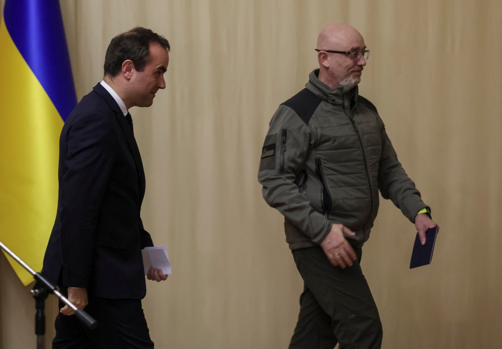 French Defence Minister Sebastien Lecornu and his Ukrainian counterpart Oleksii Reznikov leave a news conference, as Russia's attack on Ukraine continues, in Kiev, Ukraine, on December 28, 2022. REUTERS/Gleb Garanich