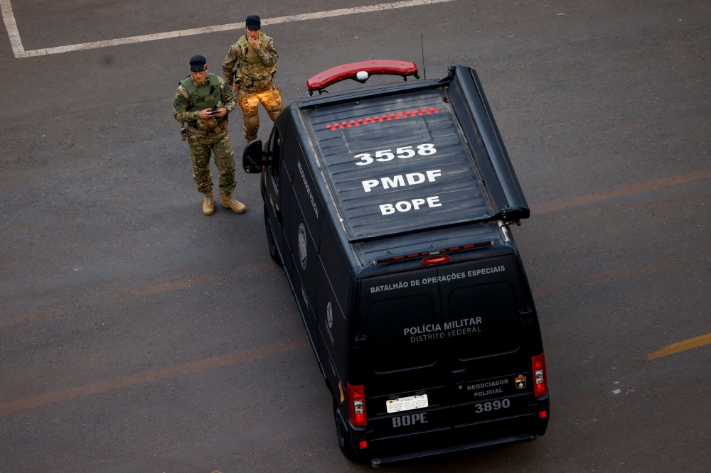 Military police members work following a suspected bomb threat in the city's hotel section, close to where President-elect Luiz Inacio Lula da Silva is staying before his Jan 1 inauguration, in Brasilia, Brazil, December 27, 2022. Reuters/Adriano Machado
