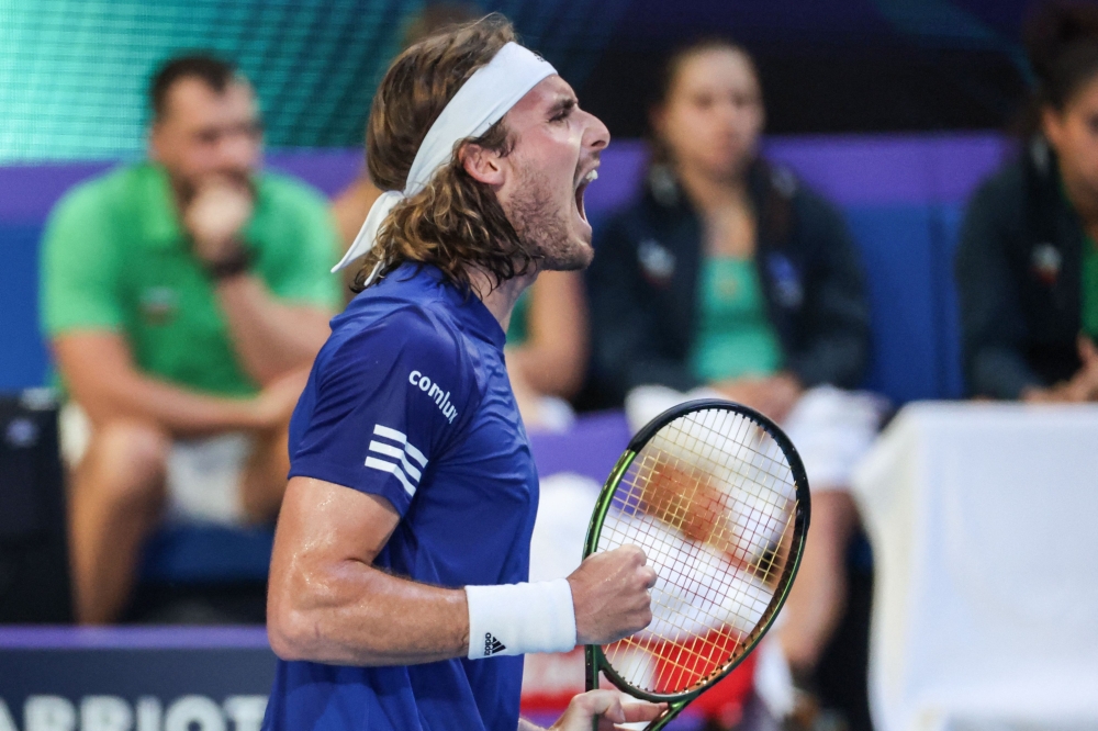 Greece's Stefanos Tsitsipas reacts after a point against Bulgaria's Grigor Dimitrov during their men's singles match at the United Cup tennis tournament in Perth on December 29, 2022. (Photo by COLIN MURTY / AFP)