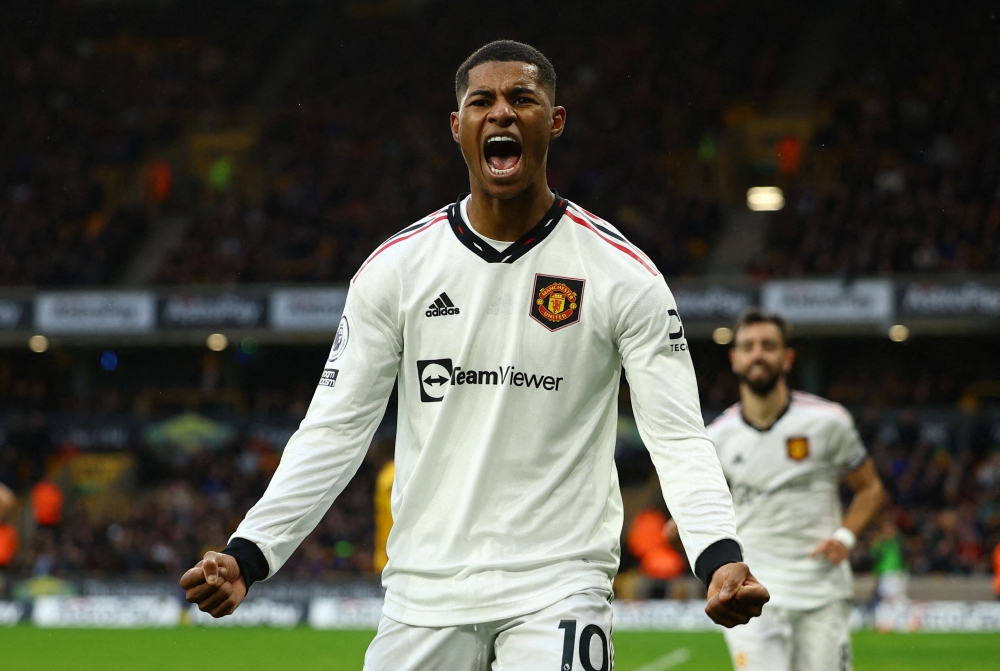 Manchester United's Marcus Rashford celebrates scoring a goal during the English Premier League match against Wolverhampton Wanderers at the Molineux Stadium, Wolverhampton, Britain on December 31, 2022.  REUTERS/Molly Darlington