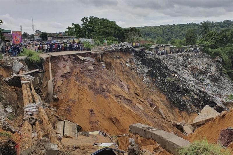 This file photo taken on November 26, 2019 shows a road surface swept away by a landslide caused by torrential overnight rains in the Lemba district of the capital Kinshasa in the Democratic Republic of Congo. (AFP)
