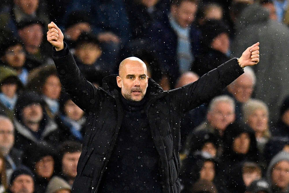 Manchester City's Spanish manager Pep Guardiola gestures on the touchline during the English Premier League football match between Manchester City and Everton at the Etihad Stadium in Manchester, north west England, on December 31, 2022. (Photo by Oli SCARFF / AFP)