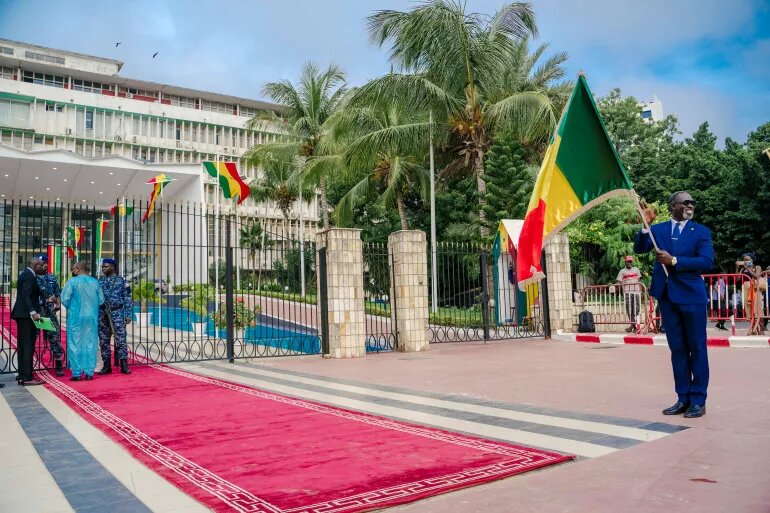 A man holds a Senegalese flag outside the Parliament in Dakar on September 12, 2022.  File Photo / AFP