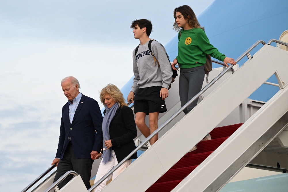 US President Joe Biden and First Lady Jill Biden disembark Air Force One with their grandchildren Natalie and Hunter at Joint Base Andrews in Maryland on January 2, 2023. - The Bidens are returning to the White House following a holiday vacation in the US Virgin Islands. (Photo by SAUL LOEB / AFP)