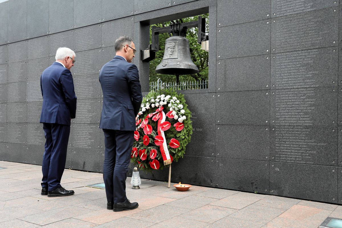 File Photo: German Foreign Minister Heiko Maas and his Polish counterpart Jacek Czaputowicz pay respect at the Wall of Remembrance as they commemorate the 75th anniversary of Warsaw Uprising at Warsaw Rising Museum in Warsaw, Poland, August 1, 2019. (Agencja Gazeta/Slawomir Kaminski via REUTERS)