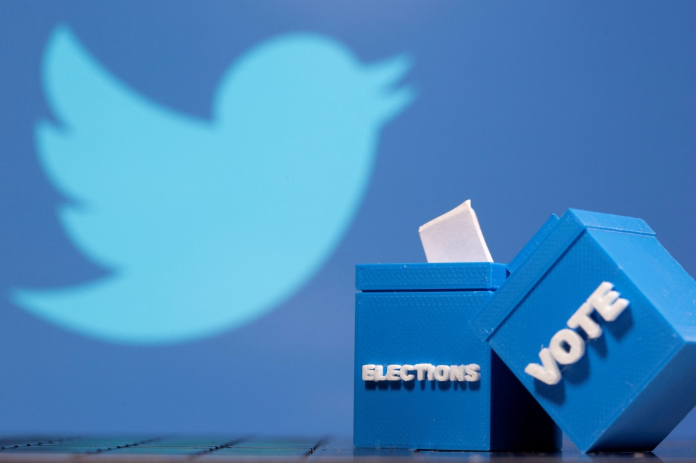 3D-printed ballot boxes are seen in front of a displayed Twitter logo in this illustration taken on November 4, 2020. File Photo / Reuters
