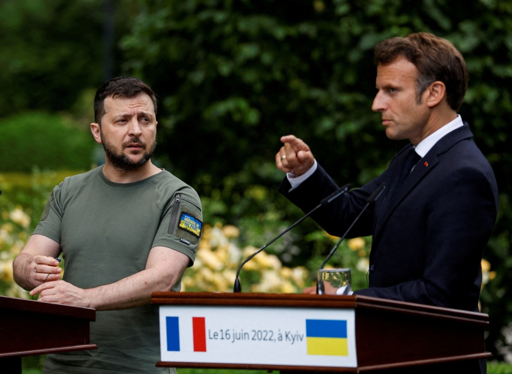 File Photo: French President Emmanuel Macron and Ukrainian President Volodymyr Zelenskiy attend a joint news conference, as Russia's attack on Ukraine continues, in Kyiv, Ukraine June 16, 2022. (REUTERS/Valentyn Ogirenko)