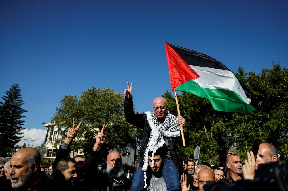 Karim Younis gestures as he is welcomed at his village in Ara, Israel January 5, 2023. Reuters/Ammar Awad