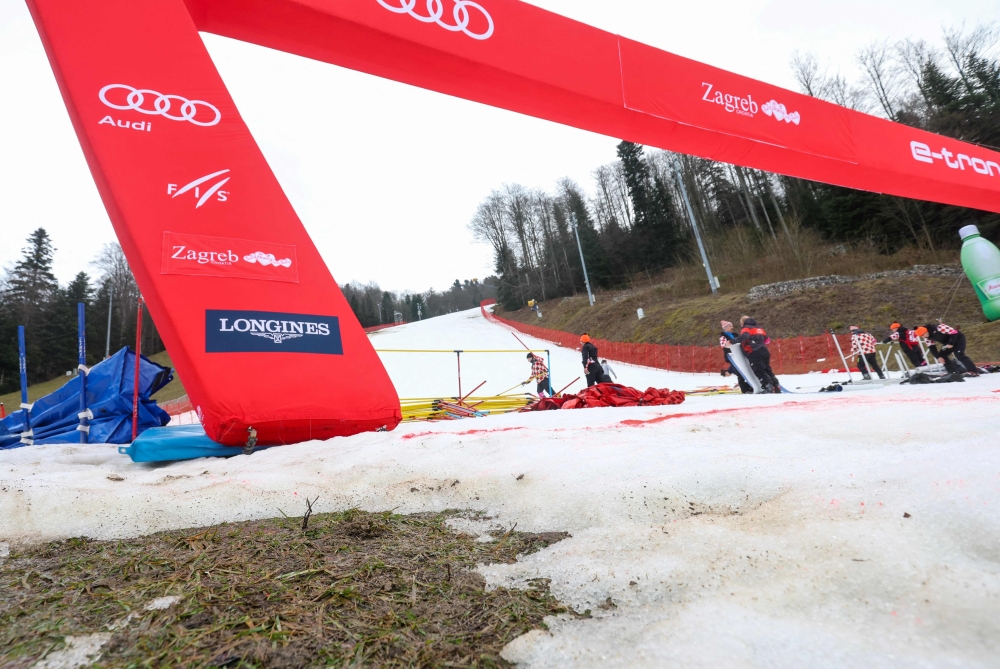 This photograph taken on January 5, 2023, shows patches were snow has melted away at the finish area of the Women slalom race at the 2022/23 FIS Alpine Ski World Cup on Zagreb's Mount Sljeme. (Photo by Damir Sencar / AFP)