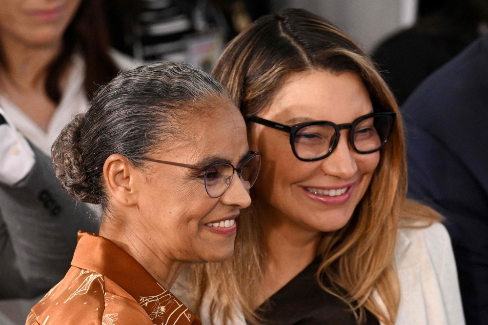 Brazil's First lady Rosangela 'Janja' da Silva (right) and Brazilian new Environment Minister Marina Silva during her swearing-in ceremony at the Planalto Palace in Brasilia on January 4, 2023. (Photo by EVARISTO SA / AFP)
