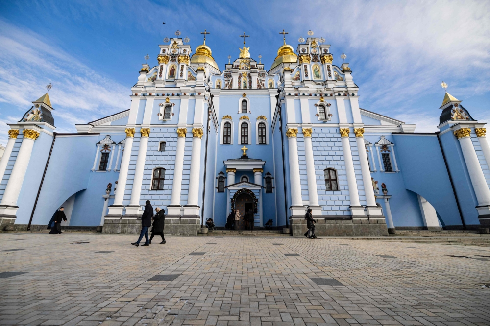 This photograph shows the St. Michael's Golden-Domed Monastery during an Orthodox Christmas service in Kyiv on January 7, 2023. (Photo by Sameer Al-DOUMY / AFP)