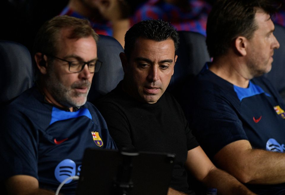 FC Barcelona coach Xavi (centre) and assistant coach Oscar Hernandez during the Champions League Group C match against Viktoria Plzen at the Camp Nou, Barcelona, Spain, on September 7, 2022.  File Photo / Reuters