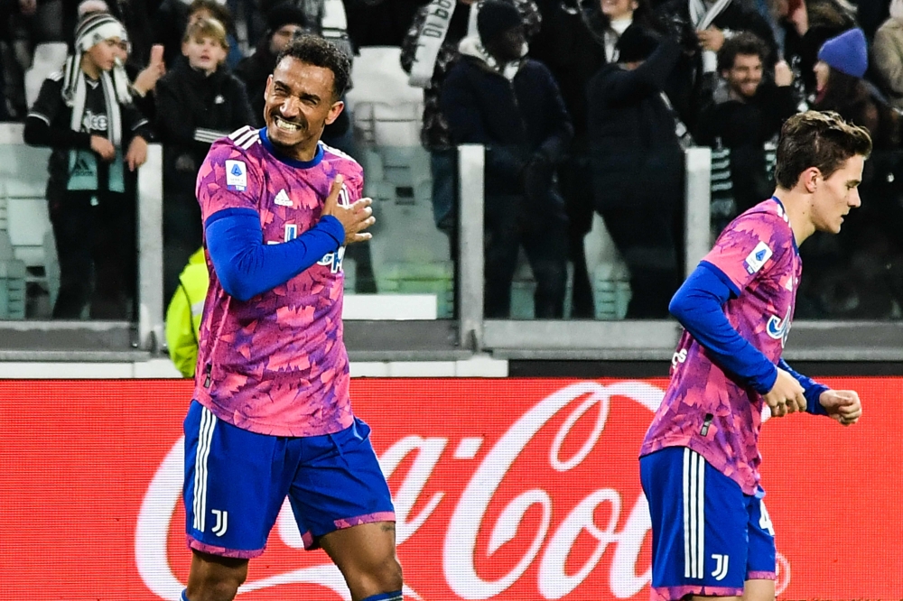 Juventus' Brazilian defender Danilo celebrates with Nicolo Fagioli after opening the scoring during the Italian Serie A match between Juventus and Udinese on January 7, 2022 at the Allianz Stadium in Turin. (Photo by Isabella BONOTTO / AFP)