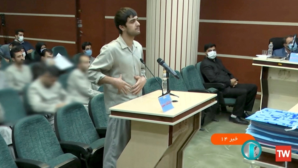 Mohammad-Mehdi Karami speaks in a courtroom before being executed by hanging, along with Seyyed Mohammad Hosseini, for allegedly killing a member of the security forces in Tehran, Iran December 2022 in this still image obtained from a video by WANA (West Asia News Agency)/Handout via Reuters