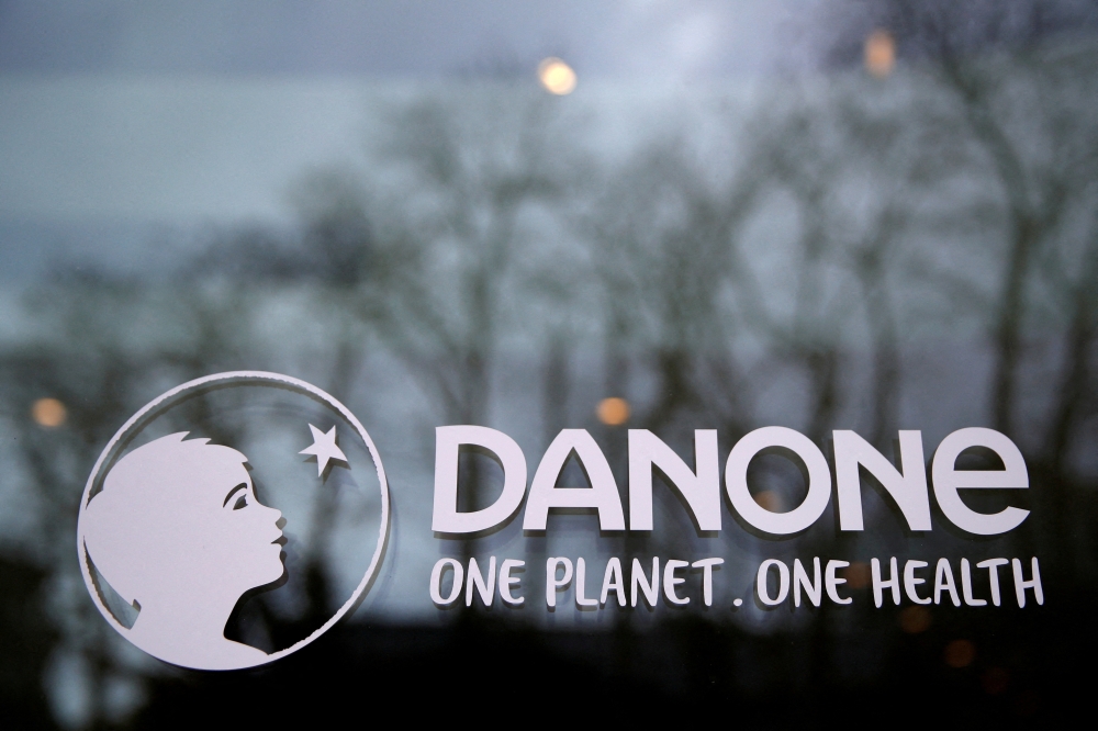 French food group Danone logo is seen at the company headquarters in Rueil-Malmaison near Paris, France, February 18, 2021. REUTERS/Gonzalo Fuentes/File Photo