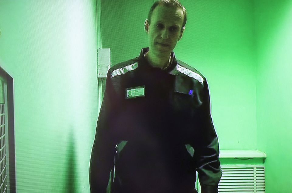 Russian opposition politician Alexei Navalny is seen on a screen via a video link during a court hearing to consider his claims against the administration of a penal colony, where he serves a sentence after being found guilty of parole violations, fraud and contempt of court charges, in the town of Kovrov, Russia October 7, 2022. File Photo / Reuters