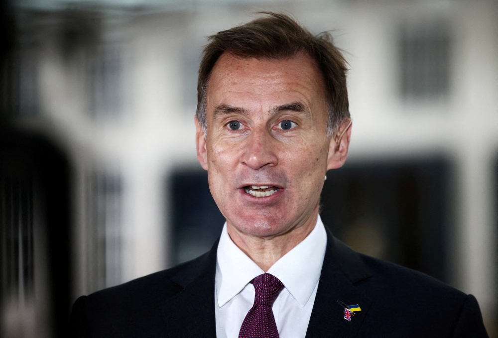 British Chancellor of the Exchequer Jeremy Hunt talks to a television crew outside the BBC headquarters in London, Britain, on November 18, 2022. File Photo / Reuters