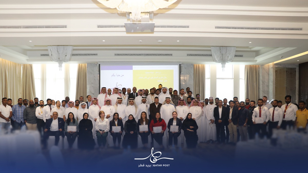 Qatar Post officials at an event honouring the volunteers.