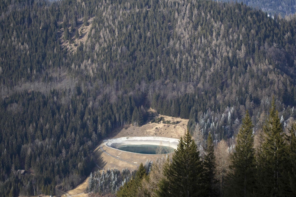 An almost empty water reservoir for the ski slope snowmaking system in the wintersport resort Zauberberg im Semmering, Lower Austria, is pictured on January 08, 2023. Many Alpine ski resorts have closed fully or partially because of the lack of snow and high temperatures as Europe has seen what experts have said is 